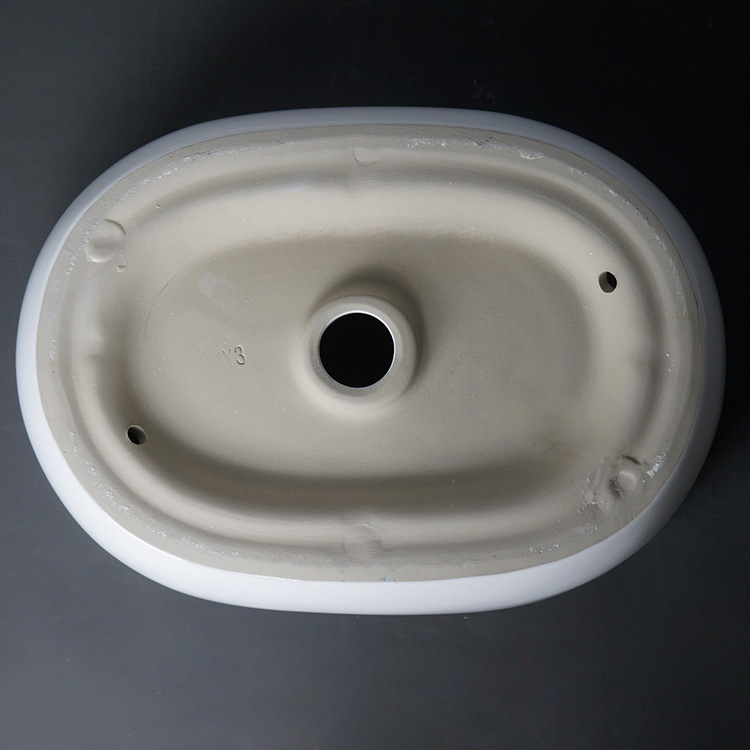 Lavabo de arte de cerámica ovalado moderno, lavabo sobre encimera para baño